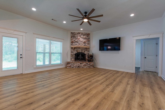 unfurnished living room with crown molding, light wood-style flooring, a ceiling fan, recessed lighting, and visible vents