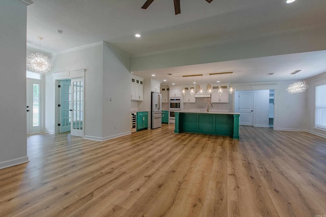 unfurnished living room featuring light wood-style floors, baseboards, and recessed lighting