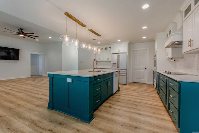 kitchen featuring white cabinets, white dishwasher, a sink, decorative backsplash, and light wood-type flooring