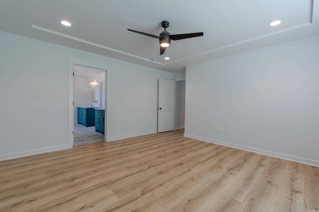 spare room with a ceiling fan, baseboards, recessed lighting, and wood finished floors