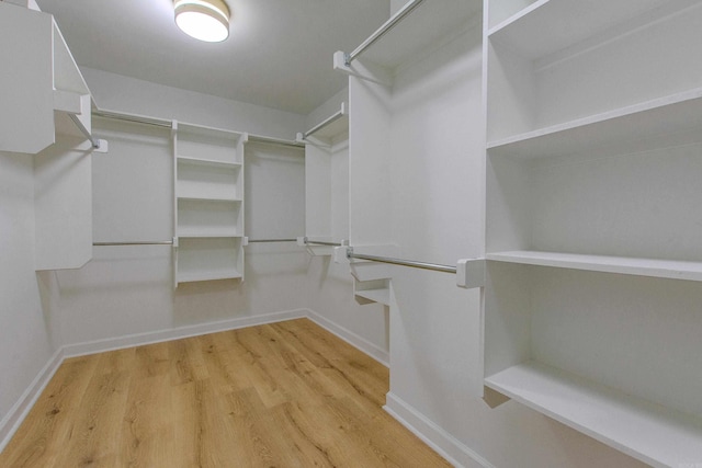 spacious closet with wood finished floors