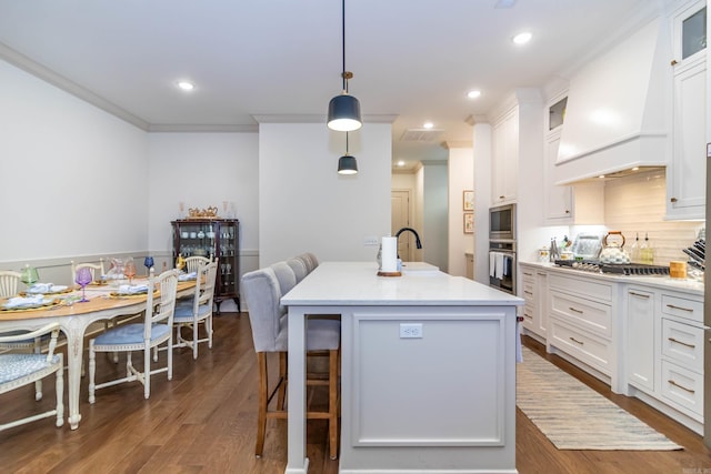 kitchen featuring white cabinetry, appliances with stainless steel finishes, glass insert cabinets, and dark wood-type flooring