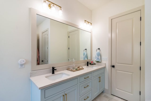 full bath with a sink and double vanity