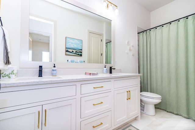 full bath with a sink, toilet, and double vanity