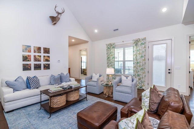 living room with recessed lighting, lofted ceiling, visible vents, and wood finished floors
