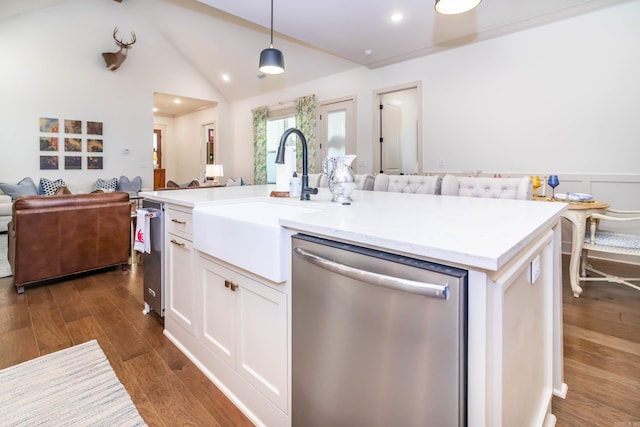 kitchen with open floor plan, white cabinets, a sink, dark wood finished floors, and dishwasher