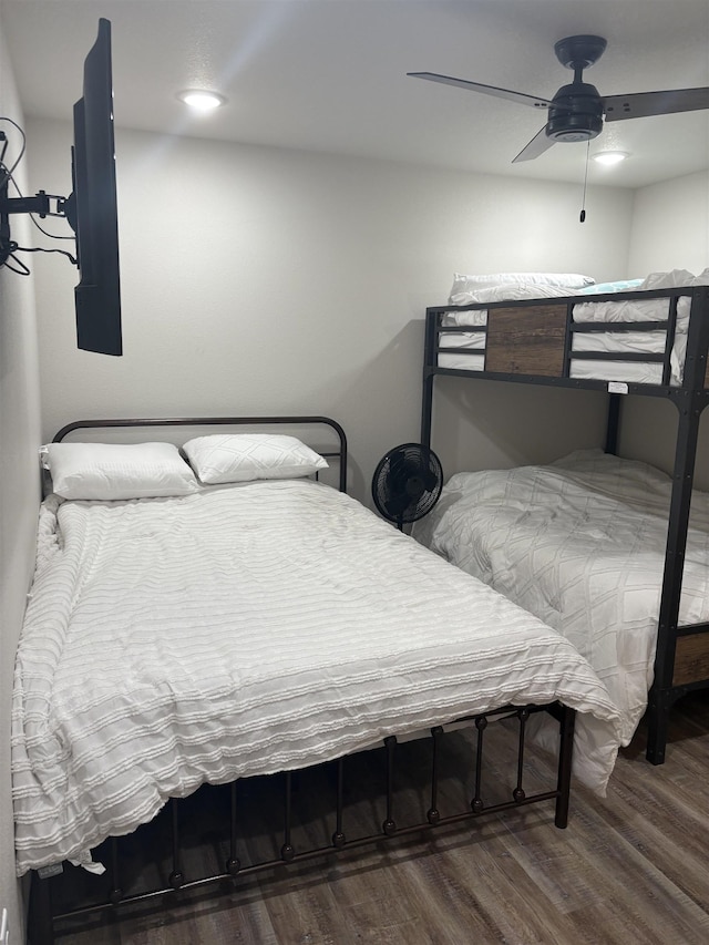 bedroom featuring a ceiling fan and wood finished floors