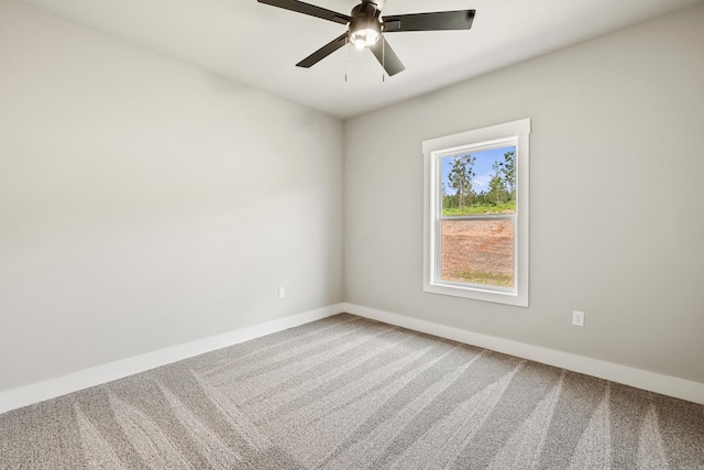 unfurnished room featuring carpet floors, baseboards, and ceiling fan