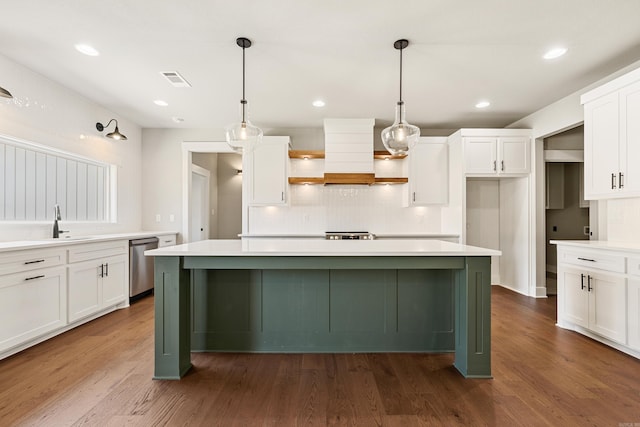 kitchen featuring stainless steel dishwasher, custom range hood, white cabinets, and light countertops