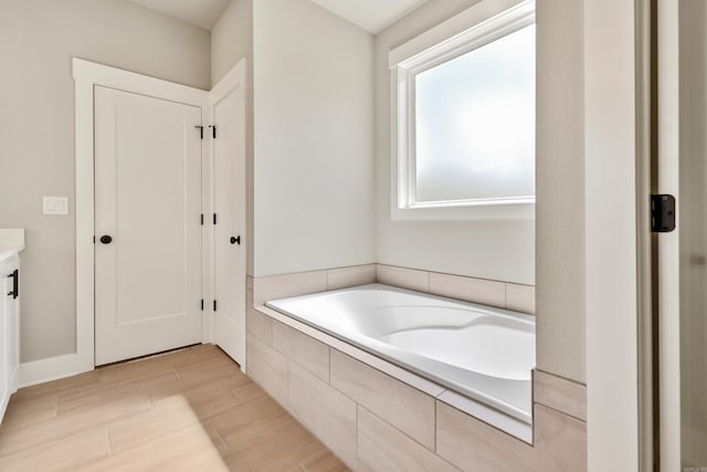 full bath featuring a bath and vanity