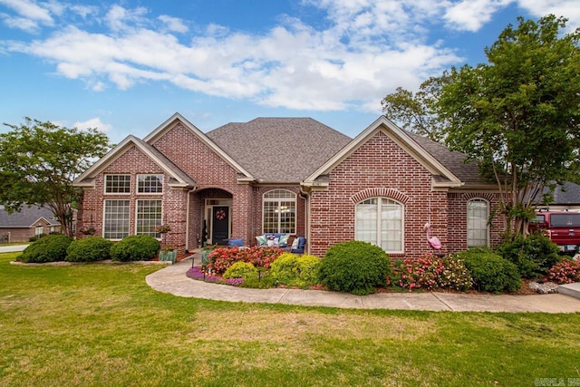 4040 Robinwood Cir, Bryant, AR 72022 - view of front of property featuring brick siding, a front yard, and roof with shingles