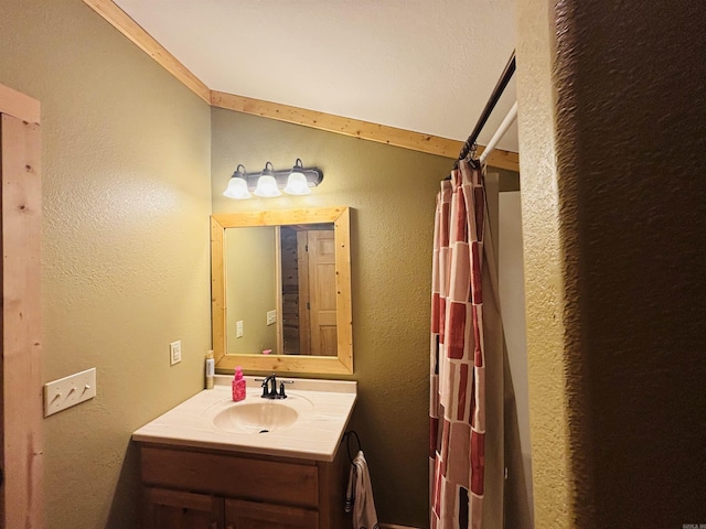 bathroom featuring a shower with curtain and vanity