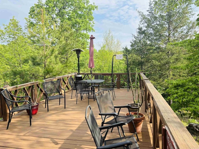 deck with outdoor dining area