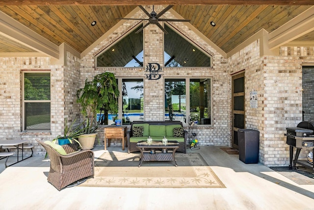 view of patio / terrace with an outdoor living space, a ceiling fan, and a grill