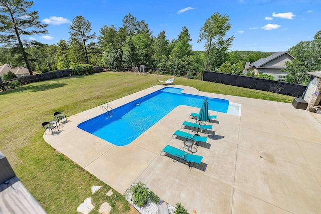view of swimming pool with a fenced in pool, a fenced backyard, a patio area, and a yard