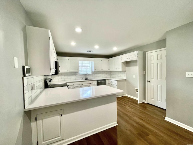 104 Louis, Searcy, AR 72143 - kitchen with a sink, a peninsula, tasteful backsplash, dark wood-style floors, and range with electric stovetop