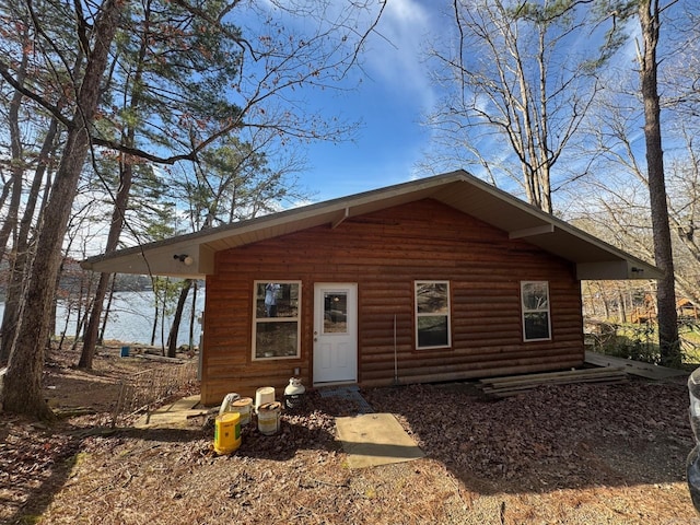 view of front of home with log veneer siding