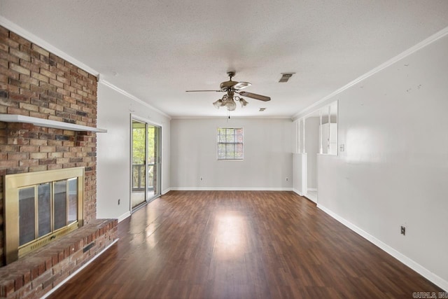 unfurnished living room featuring a ceiling fan, visible vents, ornamental molding, and wood finished floors