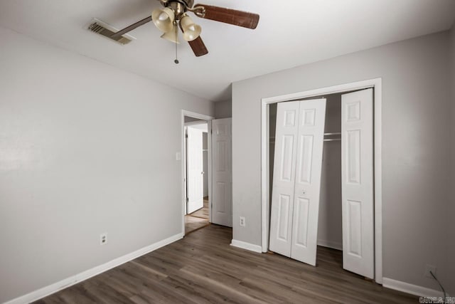 unfurnished bedroom with visible vents, baseboards, ceiling fan, and wood finished floors
