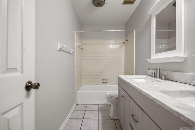 full bathroom featuring double vanity, tile patterned flooring, a sink, baseboards, and toilet
