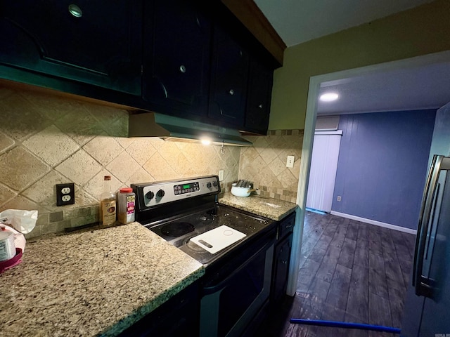 kitchen featuring stainless steel electric range oven, baseboards, dark cabinets, under cabinet range hood, and dark wood-type flooring