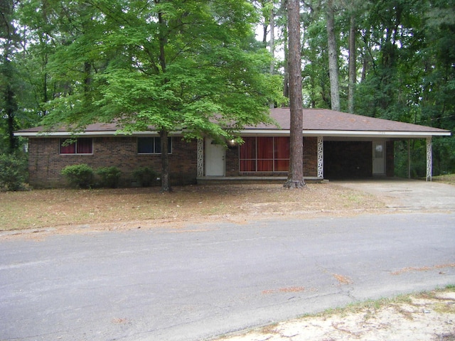 1526 Pine Manor Dr, Arkadelphia, AR 71923 - ranch-style house featuring brick siding, driveway, and an attached carport