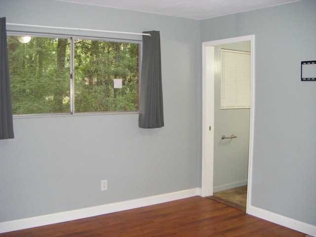 1526 Pine Manor Dr, Arkadelphia, AR 71923 - spare room with baseboards and wood finished floors
