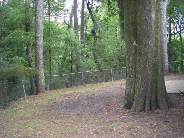 1526 Pine Manor Dr, Arkadelphia, AR 71923 - view of yard with fence and a wooded view