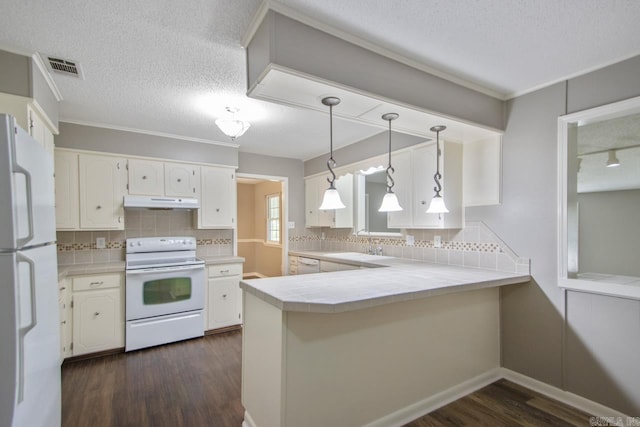 kitchen with white cabinetry, under cabinet range hood, dark wood finished floors, and white appliances