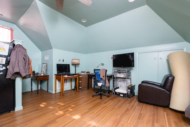 office with baseboards, wood finished floors, and lofted ceiling