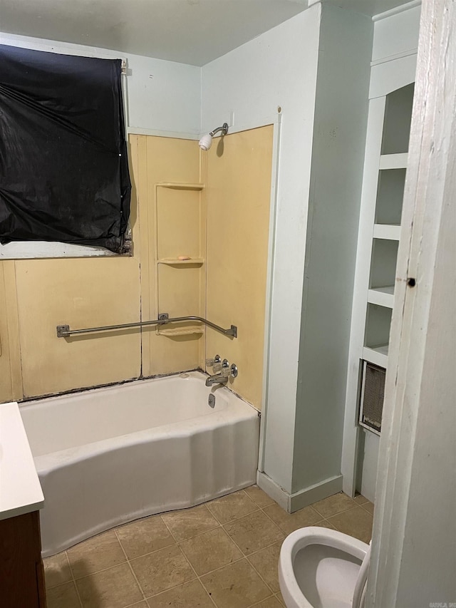 bathroom with vanity, tile patterned floors, bathtub / shower combination, and toilet