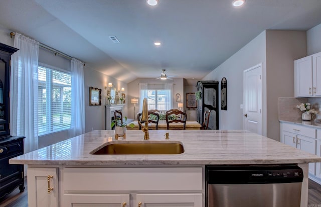 kitchen featuring stainless steel dishwasher, open floor plan, visible vents, and plenty of natural light