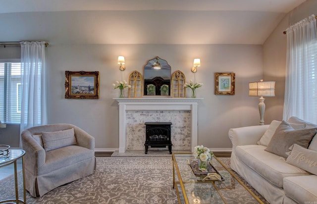 living area featuring baseboards and wood finished floors