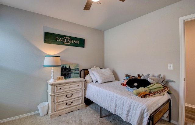 bedroom with baseboards, carpet flooring, and ceiling fan