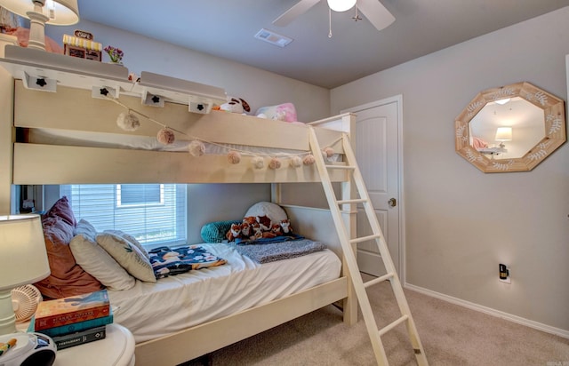 bedroom featuring carpet flooring, a ceiling fan, baseboards, and visible vents