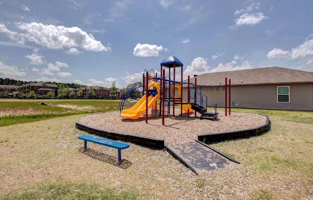 community jungle gym featuring a lawn