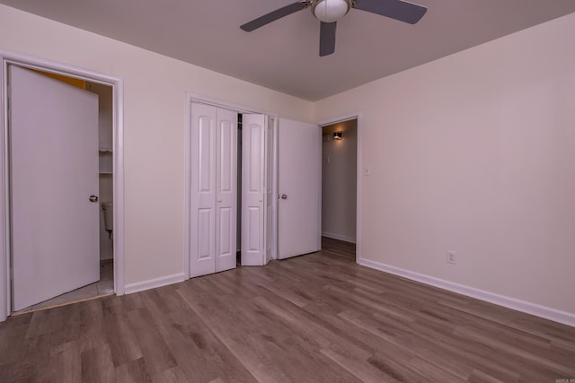 unfurnished bedroom featuring baseboards, ceiling fan, and wood finished floors
