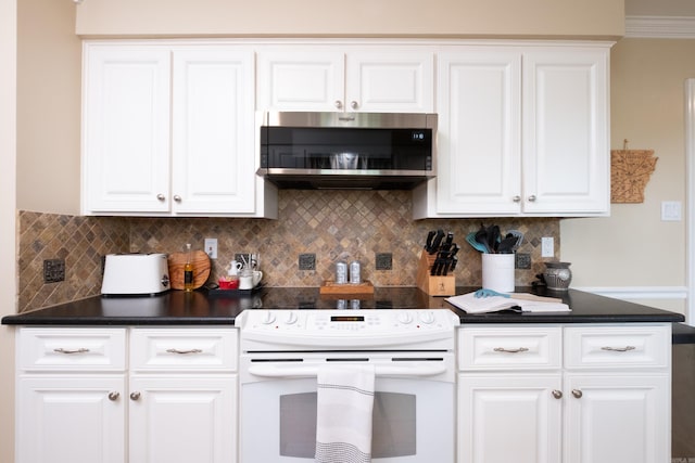 kitchen with white cabinets, dark countertops, stainless steel microwave, backsplash, and white electric stove