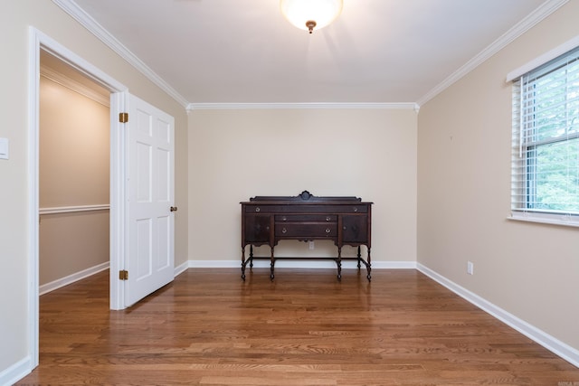 living area featuring ornamental molding, wood finished floors, and a wealth of natural light