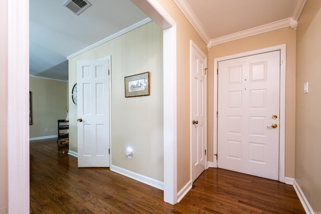 entryway with crown molding, baseboards, dark wood finished floors, and visible vents