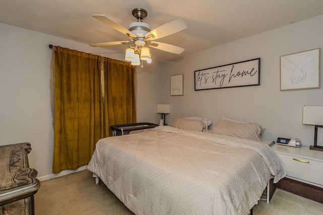 carpeted bedroom featuring a ceiling fan