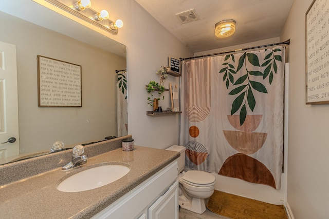bathroom with toilet, a shower with curtain, visible vents, and vanity