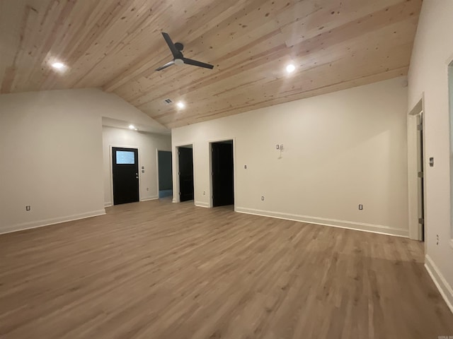 interior space featuring baseboards, a ceiling fan, lofted ceiling, and wood finished floors