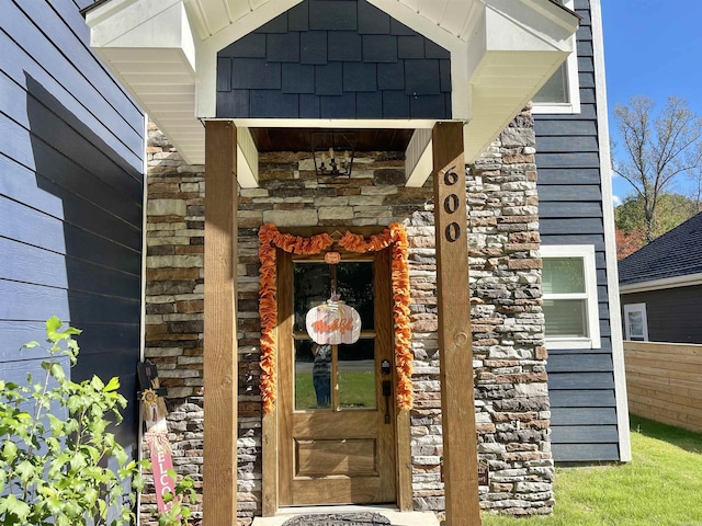 property entrance with stone siding