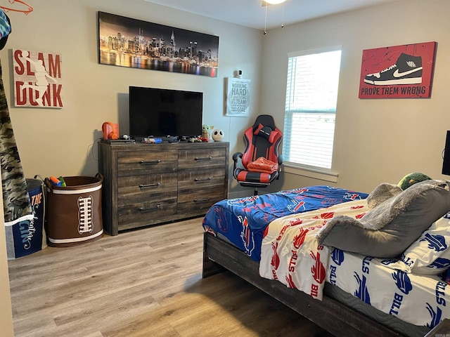 bedroom with wood finished floors