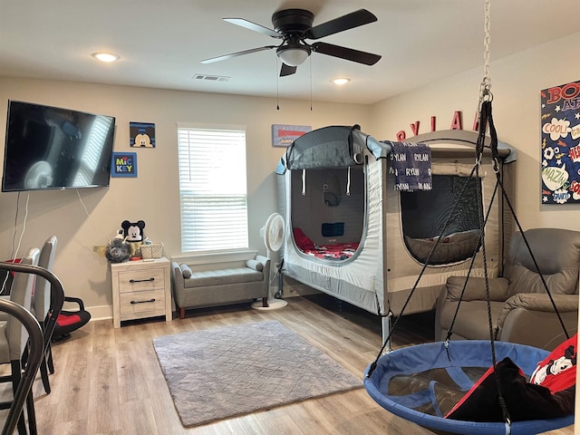 bedroom with visible vents, wood finished floors, baseboards, recessed lighting, and a ceiling fan