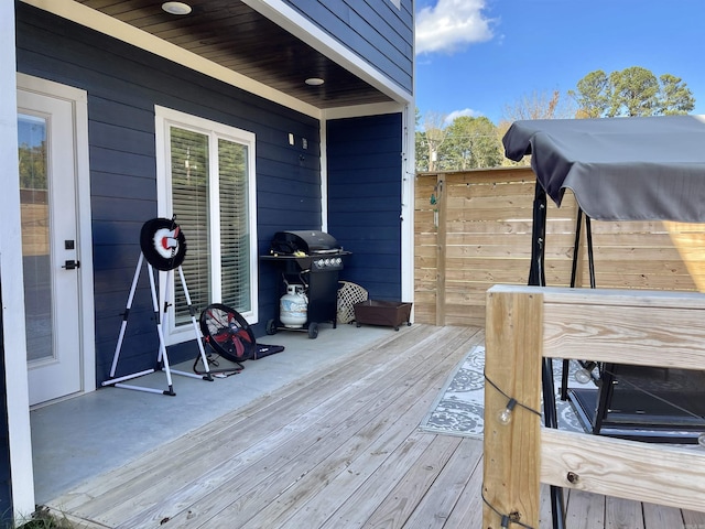 wooden terrace featuring area for grilling