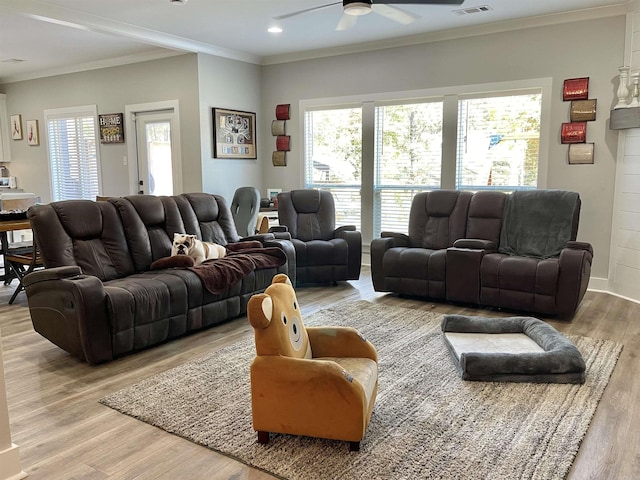 living room with recessed lighting, ceiling fan, ornamental molding, and wood finished floors