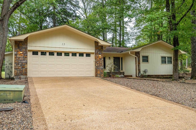 15 Tarifa Ln, Hot Springs Village, AR 71909 - ranch-style home with an attached garage, concrete driveway, and stone siding
