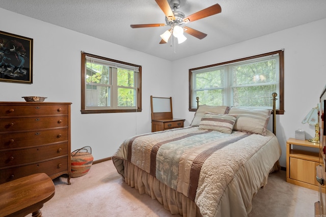 15 Tarifa Ln, Hot Springs Village, AR 71909 - bedroom featuring a ceiling fan, baseboards, light colored carpet, and a textured ceiling